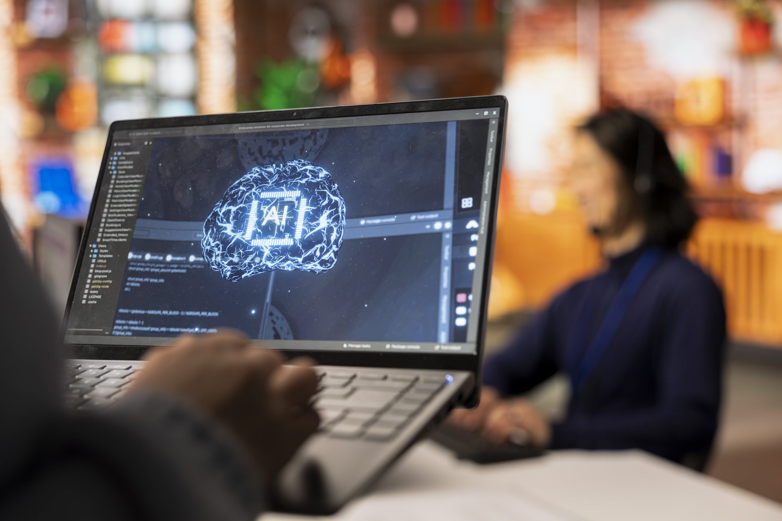 call-center-worker-using-ai-tech-laptop-reply-customers-closeup-min